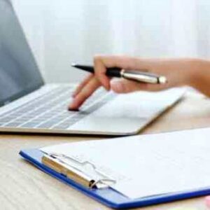 Content creator with laptop and clipboard